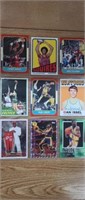9 assorted basketball cards in plastic binder