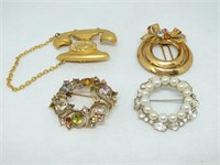 FOUR VINTAGE BROOCHES