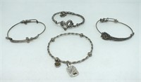 FOUR SILVER BRACELETS