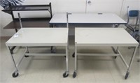 Lot of 4 includes (3) Rolling media tables and