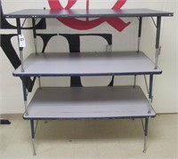 (3) Adjustable height tables. Measures 60" W x