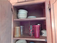 Cupboard of mugs, cups and dishes