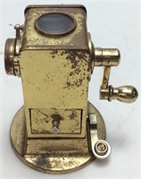 EARLY BRASS PENCIL SHARPENER WITH WINDOW VIEW