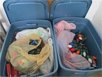 3 blue totes with Christmas lights