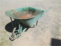 old heavy steel wheeled wheelbarrow