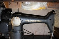 Singer Sewing Machine in wooden table cabinet