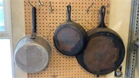 Strainer And Cast Iron Skillets