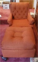 Rust colored chair and foot rest
