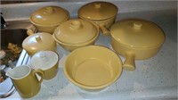 Set of yellow cookware, casserole dishes & cream &