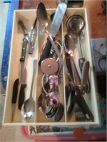 Utensil divided tray full of kitchen utensils