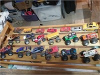 Shoe rack of collection of small monster trucks