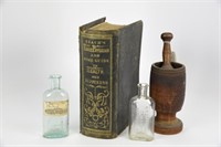 Mortar & Pestle, Medicine Bottles & Book on Health