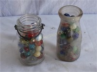 2 Small Glass containers of Marbles