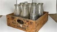 VINTAGE BOX (HAS BORER) WITH MILK BOTTLES AND RACK