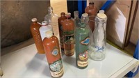 ASSORTED GLASS BOTTLES INCLUDES
