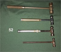 Four small hammers; at least one has a screwdriver
