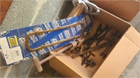 Box of misc tools, horseshoes and overhead light