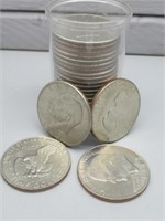 (25) Assorted clad Ike dollars.
