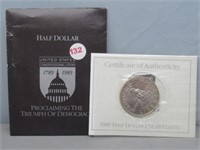 1989-D Liberty clad UNC half dollar with COA.
