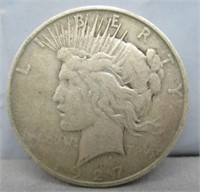 1927-D Peace silver dollar.