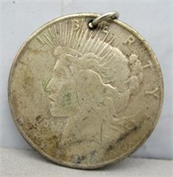 Holed 1923-S Peace silver dollar.