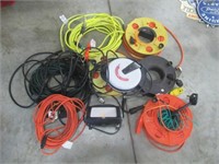 Large group of extension cords, some on reels.
