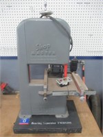 Shop Master bench top band saw with extra blades.
