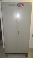 Gun cabinet on casters. Measures 78" H x 36" W x