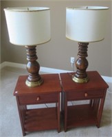 Pair of wood single drawer end tables with lamps.
