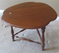 Drop leaf V shaped table made by Ethan Allen.