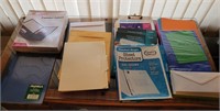Assorted office folders, envelopes, color paper