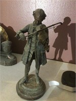 Metal statue of fiddler