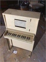 Child’s piano, works 32 inches tall