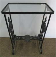 Cast Iron Glass Top Table. Measures 28" T x 18.5"