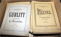2 boxes and 3 bags of piano sheet music & books