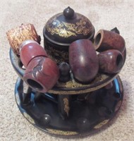 Vintage smoking stand with pipes. Approximately
