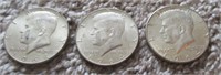 (3) 1964 Kennedy silver dollars.