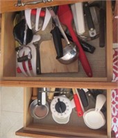 Kitchen items including measuring cups, utensils,