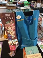 Girl Scout vest and banner filled with badges