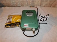 12 Volt Battery Powered Fence Charger And Bag Of
