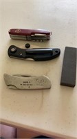 3 pocket  knives / sharpening stone