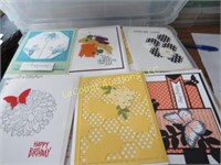 assorted hand made greeting cards in storage bin