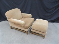 TAN UPHOLSTERED ARMCHAIR WITH FOOTSTOOL