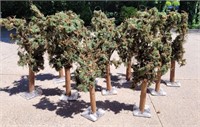 10 3ft artificial fir trees on metal bases. By