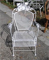 Antique wrought iron leaf decorated garden chair