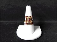 10K GOLD FILAGREE STYLE RING WITH OVAL CUT RED