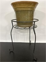 Metal plant stand and glazed clay pot
