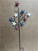 Red white and blue metal star yard art