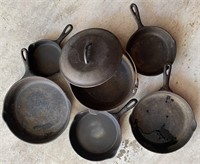 LOT OF CAST IRON POTS AND PANS