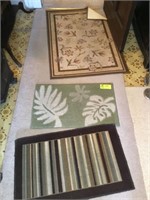 GROUP OF RUGS IN FOYER